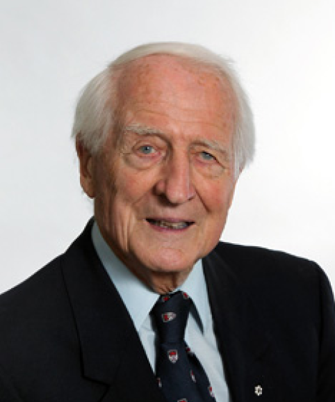 Photograph of Dr. Bocking, an elderly man in a suit with white hair.